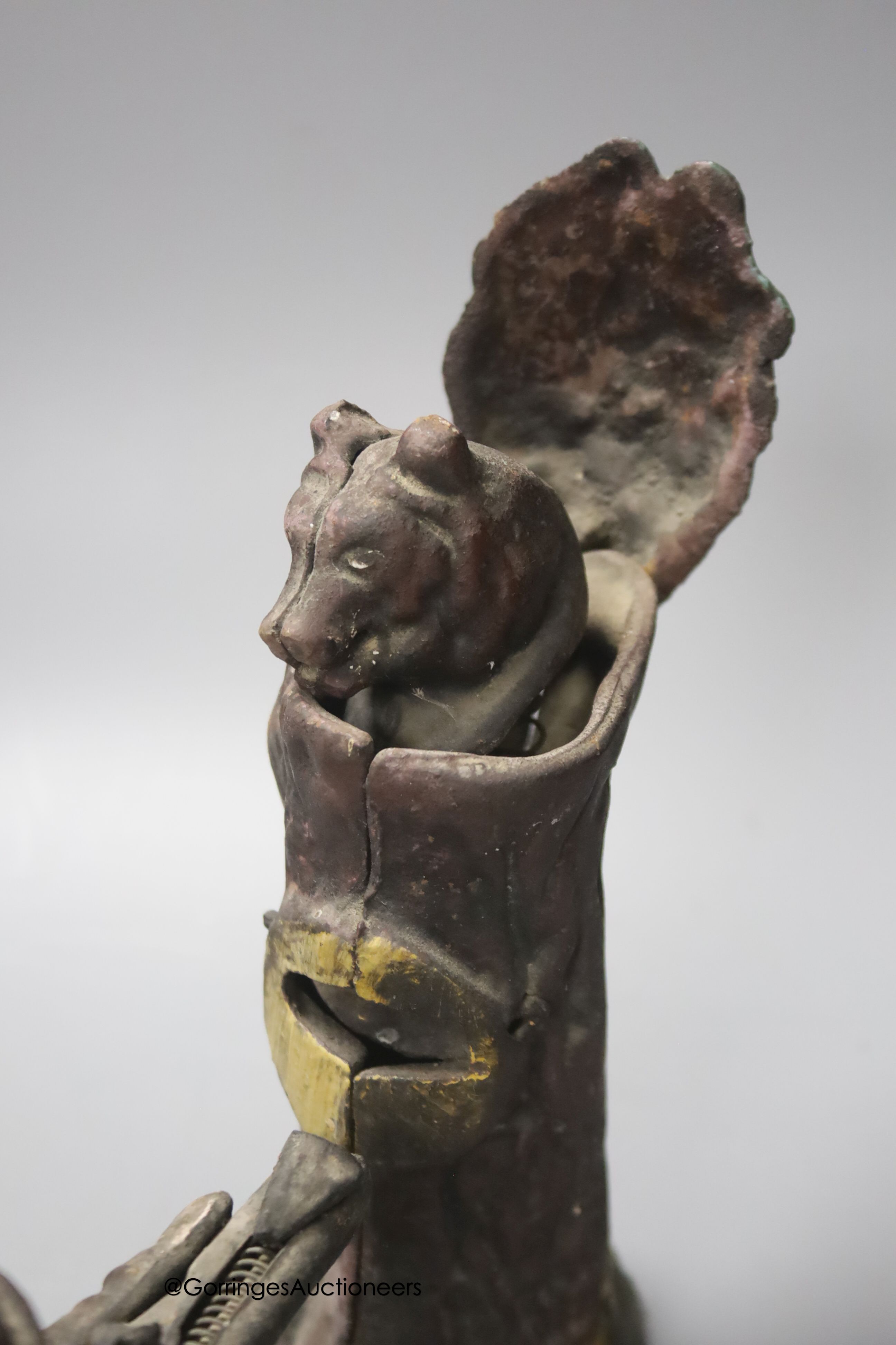 A cast iron Creedmore-type novely money bank, width 24cm, and a small copper horn, in leather case
